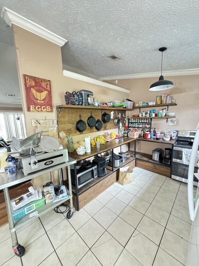 7810 Santa Clara Blvd, Fort Pierce, FL 34951 - kitchen featuring double oven range, crown molding, tile patterned floors, and a textured ceiling