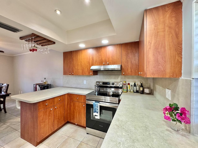 15015 SW 49th Ln Unit A-113, Miami, FL 33185 - kitchen featuring under cabinet range hood, stainless steel electric range, a peninsula, brown cabinets, and recessed lighting