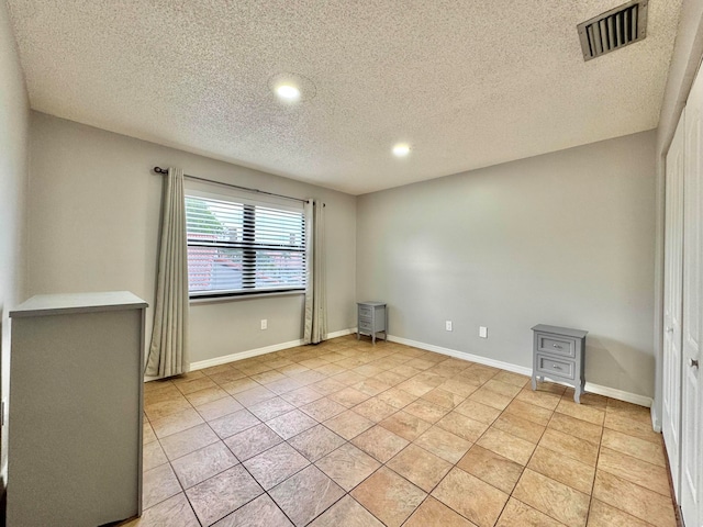 15015 SW 49th Ln Unit A-113, Miami, FL 33185 - unfurnished room with a textured ceiling, recessed lighting, baseboards, and light tile patterned floors