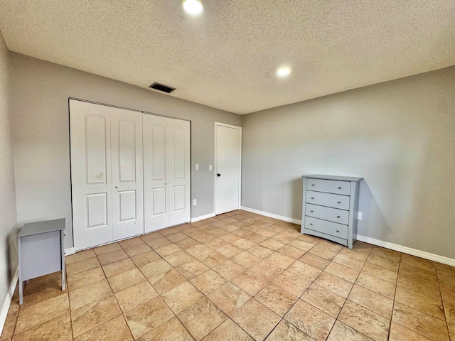 15015 SW 49th Ln Unit A-113, Miami, FL 33185 - unfurnished bedroom with a closet, baseboards, a textured ceiling, and recessed lighting