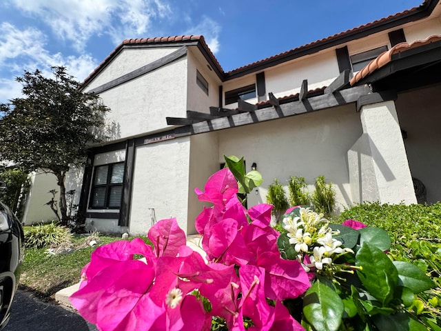 15015 SW 49th Ln Unit A-113, Miami, FL 33185 - view of side of home featuring stucco siding and a tile roof