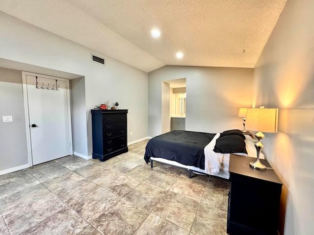 15015 SW 49th Ln Unit A-113, Miami, FL 33185 - bedroom with lofted ceiling, a textured ceiling, and baseboards