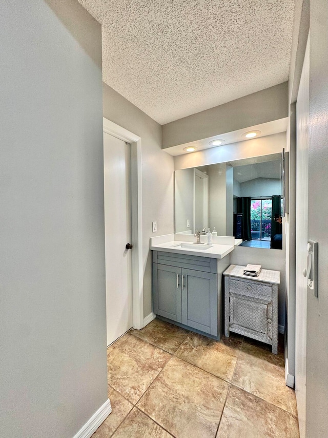 15015 SW 49th Ln Unit A-113, Miami, FL 33185 - bathroom with vanity, baseboards, and a textured ceiling