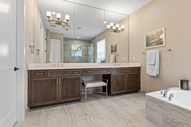 9657 Sterling Shores St, Delray Beach, FL 33446 - bathroom featuring a chandelier, double vanity, a shower stall, and a bath