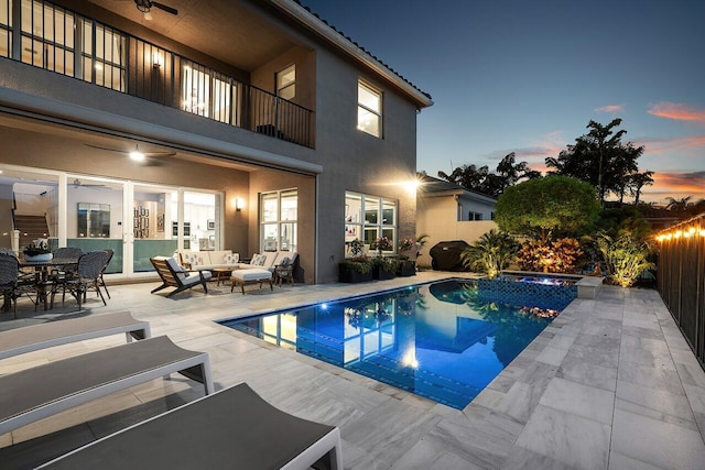 9657 Sterling Shores St, Delray Beach, FL 33446 - pool at dusk with an outdoor hangout area, a patio area, and ceiling fan