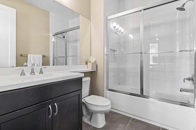 9657 Sterling Shores St, Delray Beach, FL 33446 - bathroom with toilet, vanity, bath / shower combo with glass door, and tile patterned floors
