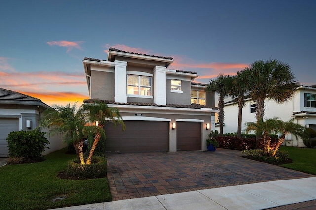 9657 Sterling Shores St, Delray Beach, FL 33446 - view of front of house featuring a tiled roof, a garage, decorative driveway, and stucco siding
