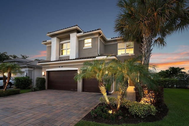 9657 Sterling Shores St, Delray Beach, FL 33446 - mediterranean / spanish home featuring stucco siding, decorative driveway, a garage, and a tiled roof