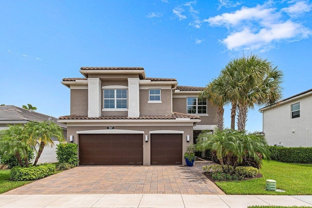 9657 Sterling Shores St, Delray Beach, FL 33446 - mediterranean / spanish home with a garage, stucco siding, a tile roof, and decorative driveway