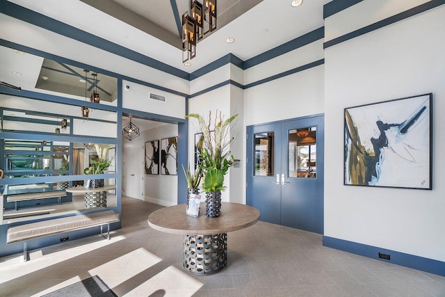 9657 Sterling Shores St, Delray Beach, FL 33446 - carpeted entryway with a chandelier, baseboards, a towering ceiling, french doors, and recessed lighting