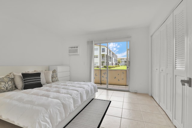 175 Fanshaw E Unit 175, Boca Raton, FL 33434 - bedroom with access to exterior, an AC wall unit, and light tile patterned flooring