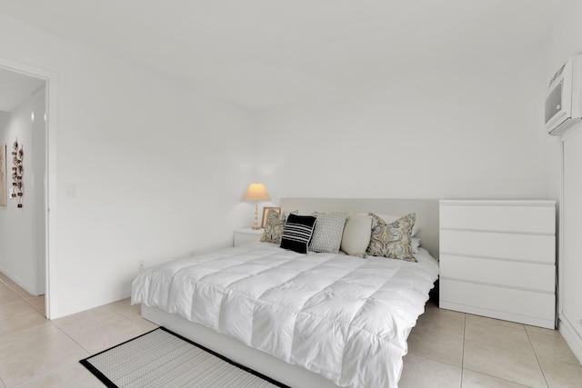 175 Fanshaw E Unit 175, Boca Raton, FL 33434 - bedroom with light tile patterned floors and a wall unit AC