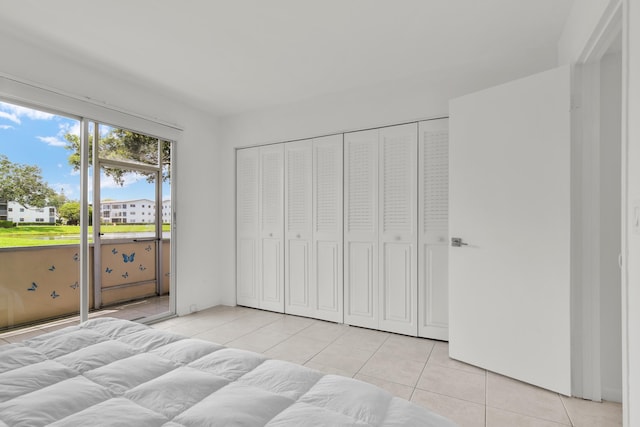 175 Fanshaw E Unit 175, Boca Raton, FL 33434 - bedroom with light tile patterned floors and access to exterior