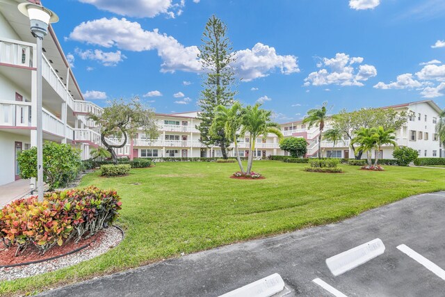 175 Fanshaw E Unit 175, Boca Raton, FL 33434 - view of property's community featuring a residential view, a yard, and uncovered parking