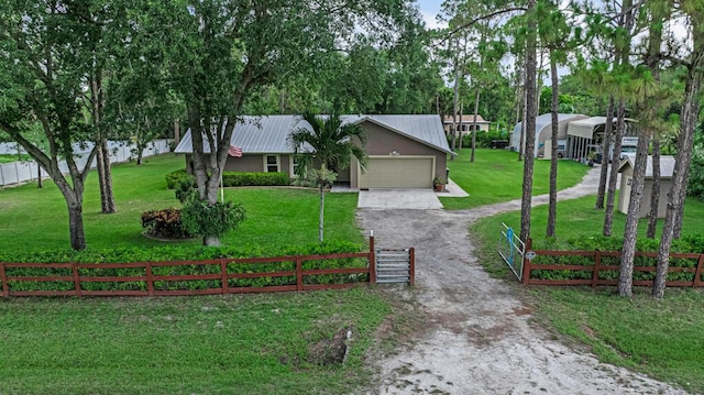 12275 N 54th St N, West Palm Beach, FL 33411 - view of front of house with driveway, an attached garage, and metal roof