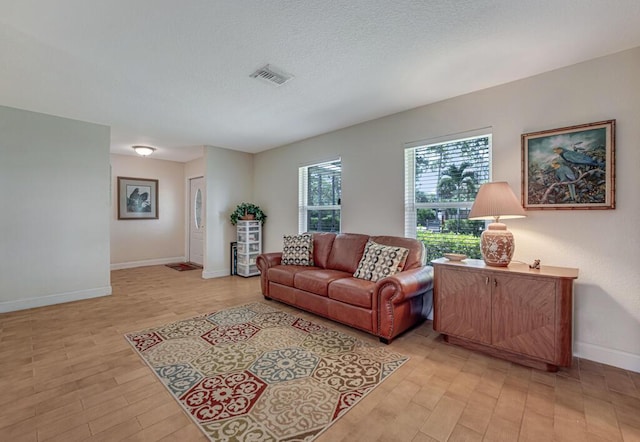 12275 N 54th St N, West Palm Beach, FL 33411 - living room featuring light wood-style flooring and baseboards