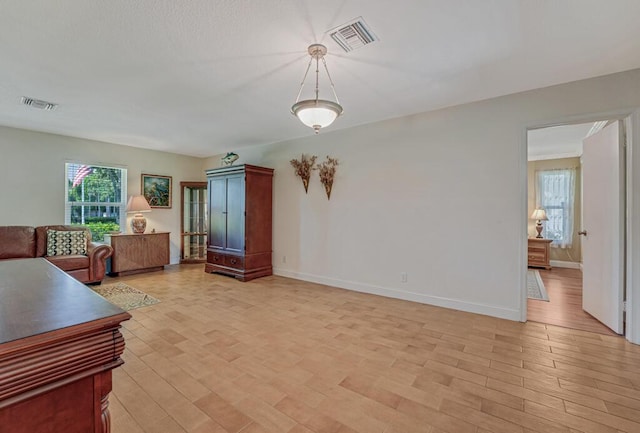 12275 N 54th St N, West Palm Beach, FL 33411 - living room featuring light wood finished floors and baseboards