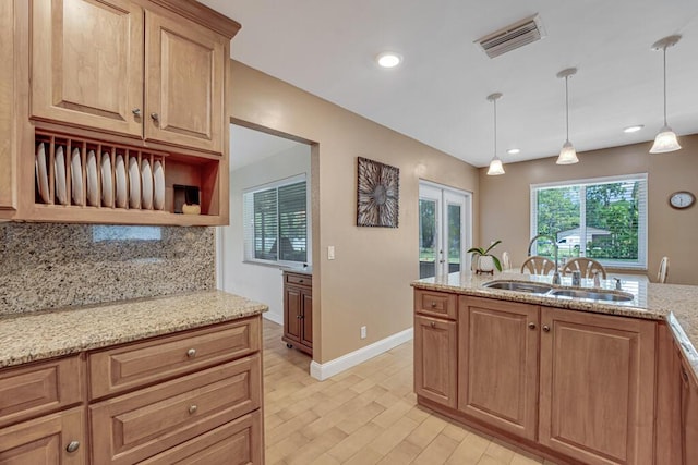 12275 N 54th St N, West Palm Beach, FL 33411 - kitchen featuring open shelves, tasteful backsplash, a sink, light stone counters, and recessed lighting
