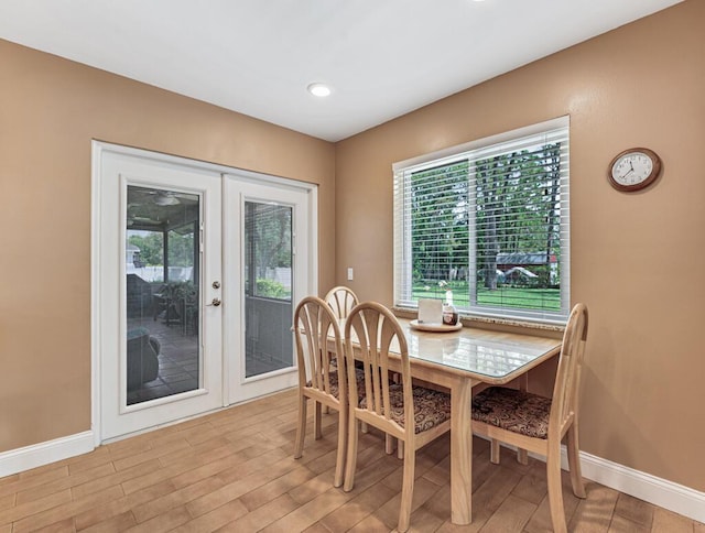 12275 N 54th St N, West Palm Beach, FL 33411 - dining room featuring french doors, baseboards, and light wood-type flooring