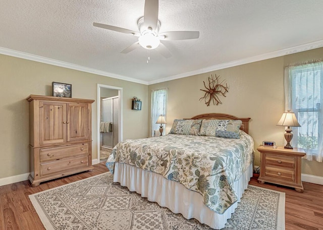 12275 N 54th St N, West Palm Beach, FL 33411 - bedroom with light wood-style floors, baseboards, ornamental molding, a textured ceiling, and a ceiling fan