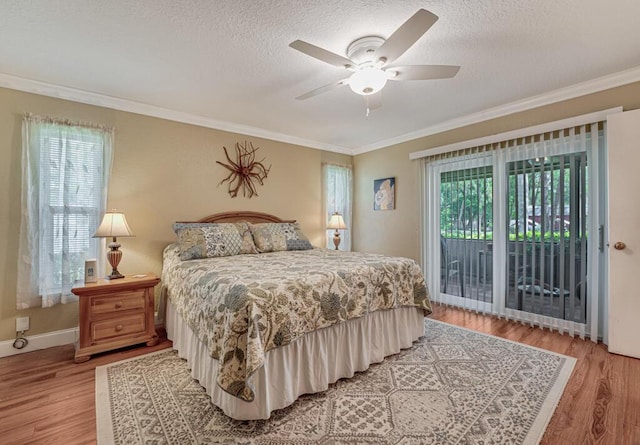 12275 N 54th St N, West Palm Beach, FL 33411 - bedroom featuring access to exterior, crown molding, light wood finished floors, a textured ceiling, and a ceiling fan
