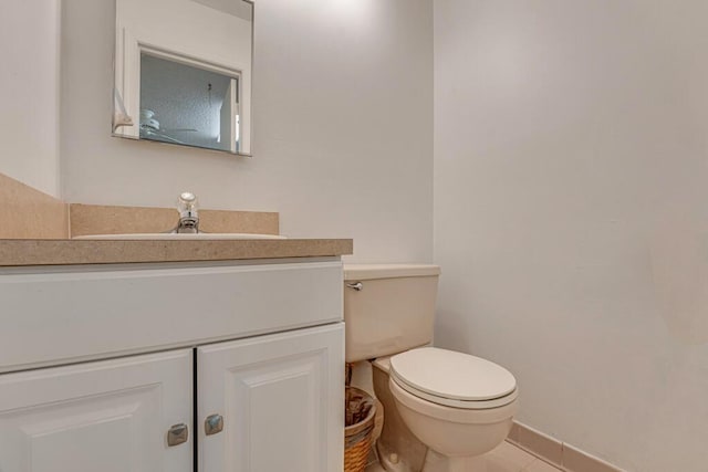 12275 N 54th St N, West Palm Beach, FL 33411 - bathroom with vanity, toilet, tile patterned flooring, and baseboards
