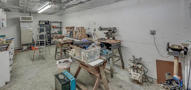 12275 N 54th St N, West Palm Beach, FL 33411 - miscellaneous room with an AC wall unit and concrete floors