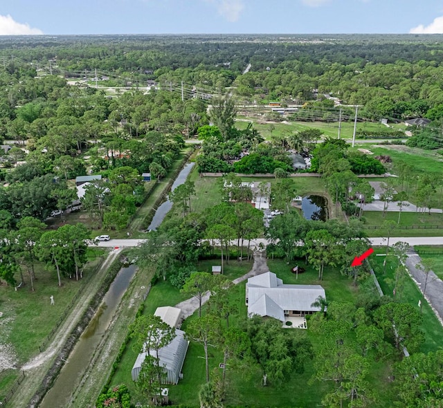 12275 N 54th St N, West Palm Beach, FL 33411 - aerial overview of property's location featuring a heavily wooded area and a nearby body of water
