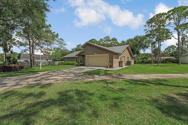 12275 N 54th St N, West Palm Beach, FL 33411 - view of front of property with driveway, an attached garage, a front yard, stucco siding, and central air condition unit