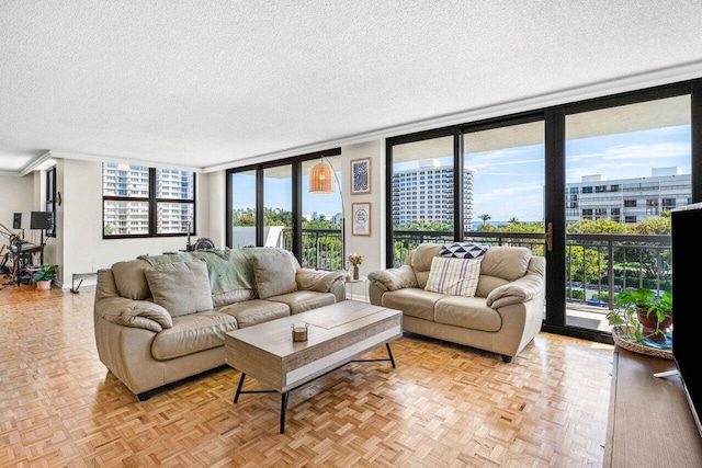 2001 N Ocean Blvd Unit 502, Boca Raton, FL 33431 - living area with a textured ceiling, expansive windows, and healthy amount of natural light