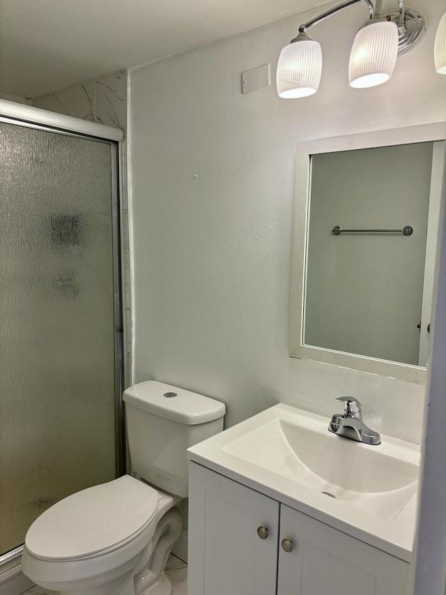 76 Cambridge Unit D, West Palm Beach, FL 33417 - bathroom with vanity, toilet, and a stall shower