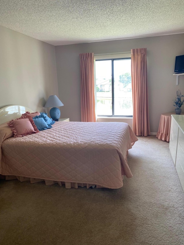 806 Sky Pine Way Unit G3, Greenacres, FL 33415 - bedroom with light colored carpet and a textured ceiling