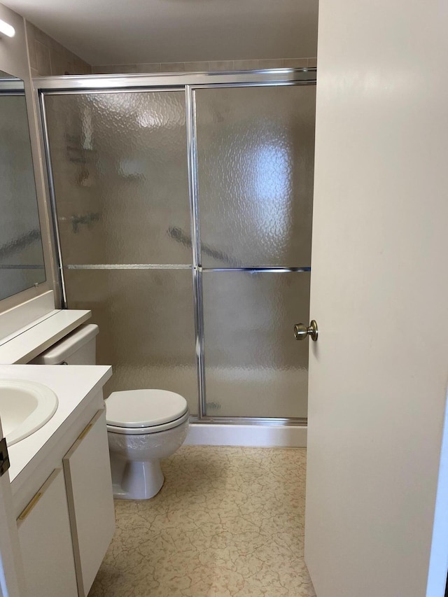 806 Sky Pine Way Unit G3, Greenacres, FL 33415 - bathroom featuring vanity, toilet, and a shower with shower door