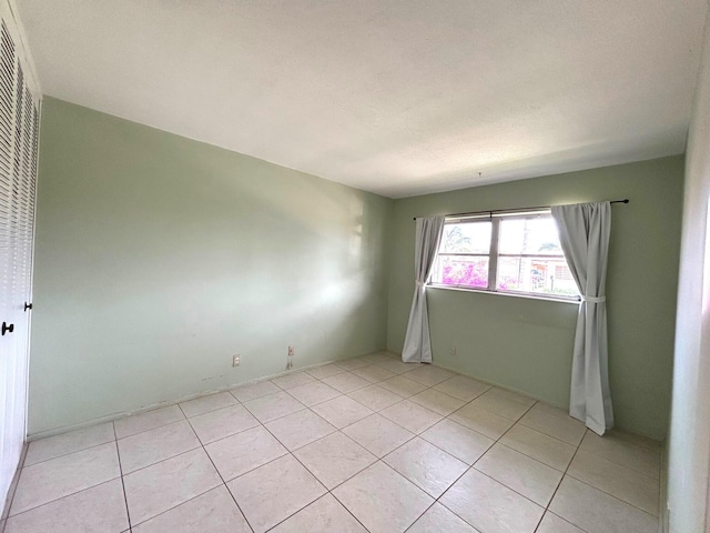 2802 Crosley Dr W Unit D, West Palm Beach, FL 33415 - empty room with light tile patterned flooring