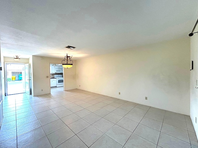 2802 Crosley Dr W Unit D, West Palm Beach, FL 33415 - unfurnished living room featuring light tile patterned flooring