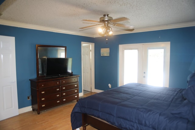 864 SE Tierra Ct, Port Saint Lucie, FL 34983 - bedroom featuring french doors, a textured ceiling, light wood-style flooring, ornamental molding, and baseboards