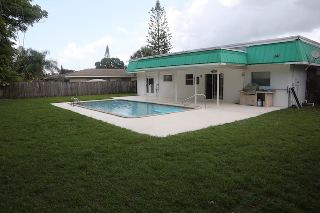 864 SE Tierra Ct, Port Saint Lucie, FL 34983 - back of property with a patio, stucco siding, and metal roof