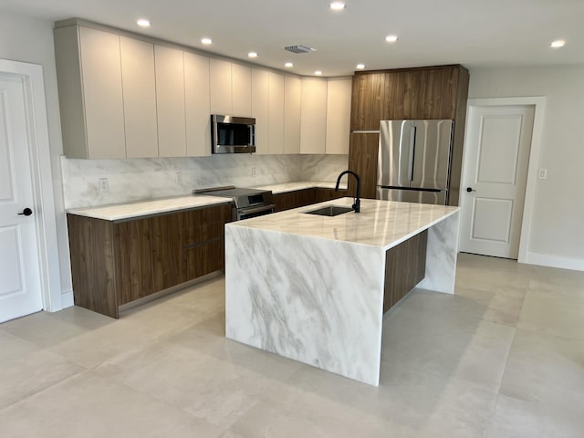 1182 SW 7th St, Boca Raton, FL 33486 - kitchen with modern cabinets, a sink, stainless steel appliances, decorative backsplash, and recessed lighting