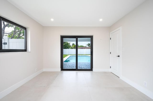 1182 SW 7th St, Boca Raton, FL 33486 - spare room featuring plenty of natural light, recessed lighting, and baseboards