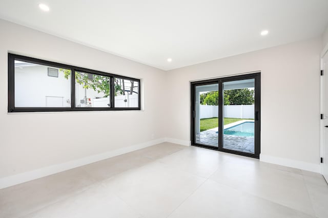 1182 SW 7th St, Boca Raton, FL 33486 - unfurnished room with plenty of natural light, baseboards, and recessed lighting