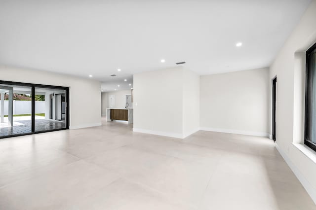 1182 SW 7th St, Boca Raton, FL 33486 - unfurnished living room featuring recessed lighting and baseboards