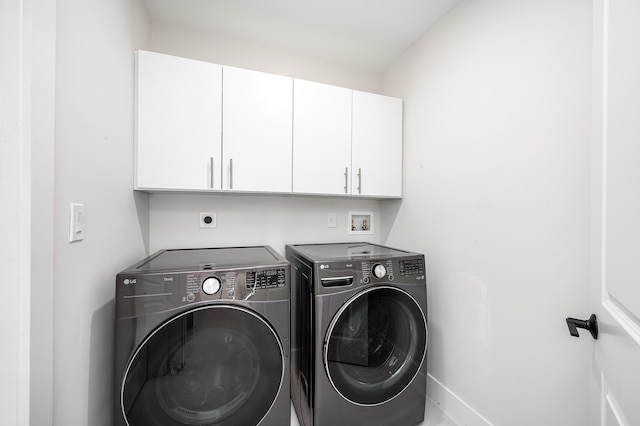 1182 SW 7th St, Boca Raton, FL 33486 - laundry area with cabinet space, washing machine and dryer, and baseboards