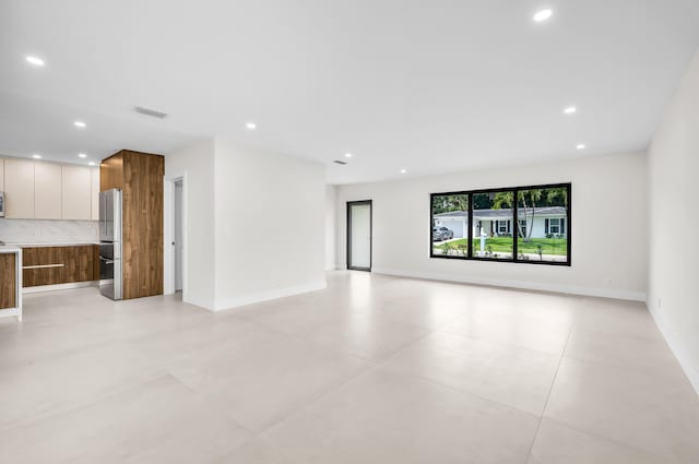 1182 SW 7th St, Boca Raton, FL 33486 - unfurnished living room featuring recessed lighting and baseboards