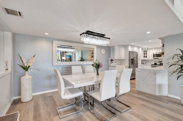 2701 N Ocean Blvd Unit E205, Boca Raton, FL 33431 - dining room with light wood-type flooring, baseboards, and recessed lighting