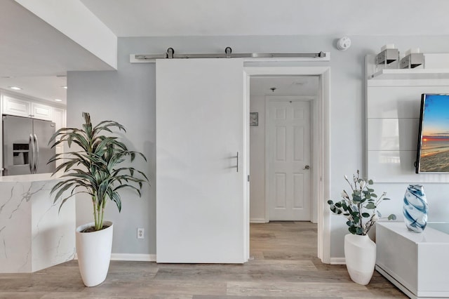 2701 N Ocean Blvd Unit E205, Boca Raton, FL 33431 - hall featuring light wood-style floors, baseboards, and recessed lighting