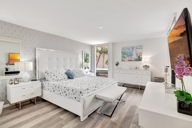 2701 N Ocean Blvd Unit E205, Boca Raton, FL 33431 - bedroom featuring wallpapered walls and light wood finished floors