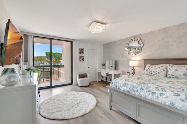 2701 N Ocean Blvd Unit E205, Boca Raton, FL 33431 - bedroom featuring access to outside and light wood-style floors