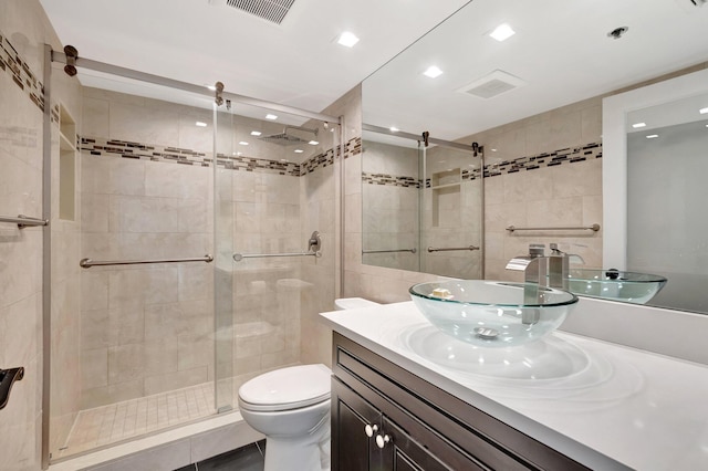 2701 N Ocean Blvd Unit E205, Boca Raton, FL 33431 - full bath with tile walls, vanity, a shower stall, toilet, and recessed lighting