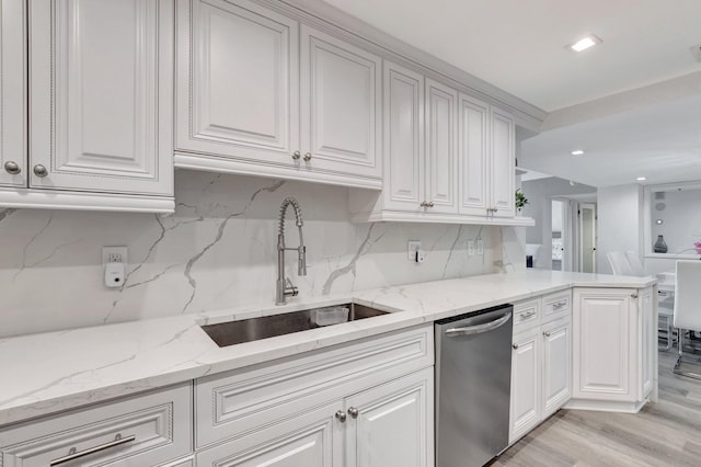 2701 N Ocean Blvd Unit E205, Boca Raton, FL 33431 - kitchen featuring dishwasher, a sink, backsplash, white cabinets, and recessed lighting