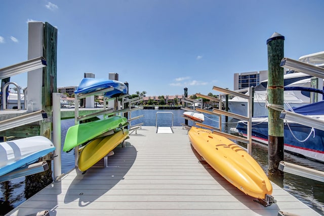 2701 N Ocean Blvd Unit E205, Boca Raton, FL 33431 - dock area featuring boat lift and a water view